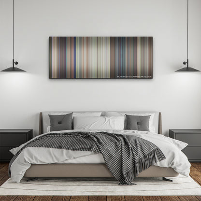 Ricky Stanicky color palette canvas above a bed, between two black pendant lamps