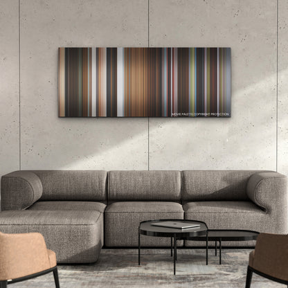 Triangle of Sadness color palette canvas on a concrete wall above a gray sectional sofa