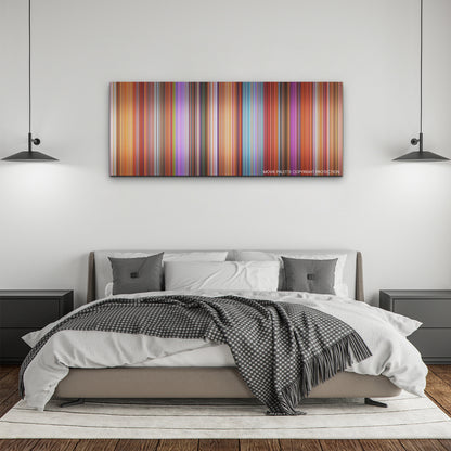 Elemental color palette canvas above a bed, between two black pendant lamps
