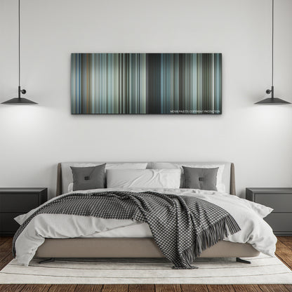 Sisu color palette canvas above a bed, between two black pendant lamps