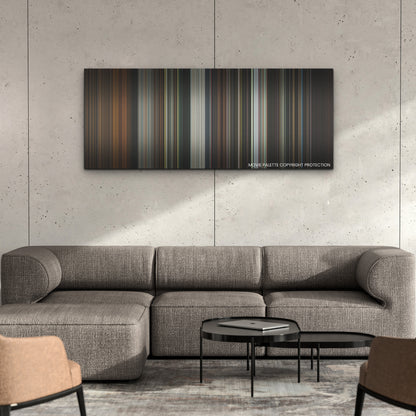 Barbarian color palette canvas on a concrete wall above a gray sectional sofa
