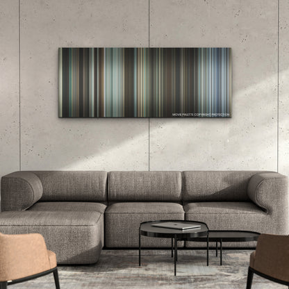 Godzilla Minus One color palette canvas on a concrete wall above a gray sectional sofa