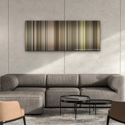 The Burial color palette canvas on a concrete wall above a gray sectional sofa