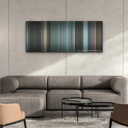 The Adam Project color palette canvas on a concrete wall above a gray sectional sofa