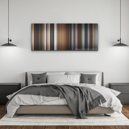 Triangle of Sadness color palette canvas above a bed, between two black pendant lamps