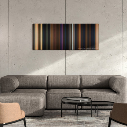 Beauty and the Beast color palette canvas on a concrete wall above a gray sectional sofa