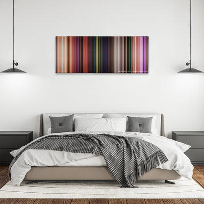 Onward color palette canvas above a bed, between two black pendant lamps