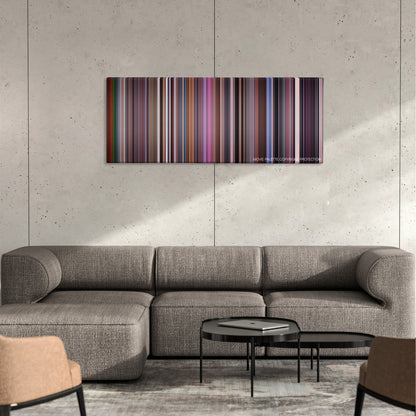 The Manchurian Candidate color palette canvas on a concrete wall above a gray sectional sofa