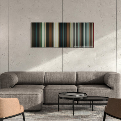 The Man from U.N.C.L.E. color palette canvas on a concrete wall above a gray sectional sofa