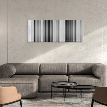 Persona color palette canvas on a concrete wall above a gray sectional sofa
