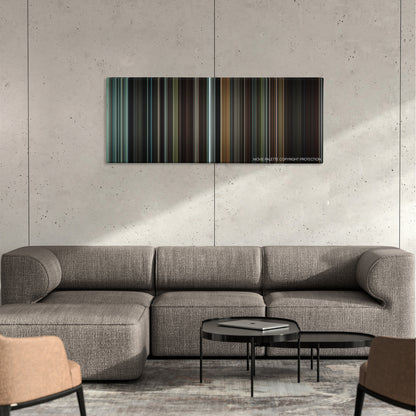 Hannibal Rising color palette canvas on a concrete wall above a gray sectional sofa