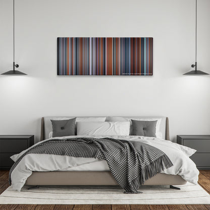 Passengers color palette canvas above a bed, between two black pendant lamps