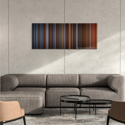 Alien3 color palette canvas on a concrete wall above a gray sectional sofa