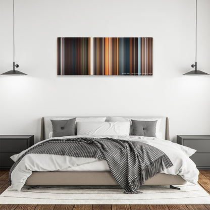 A Christmas Carol color palette canvas above a bed, between two black pendant lamps