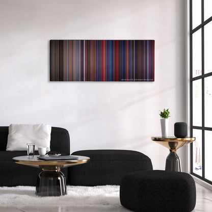 The Running Man color palette canvas above a black sofa with a gold-topped table