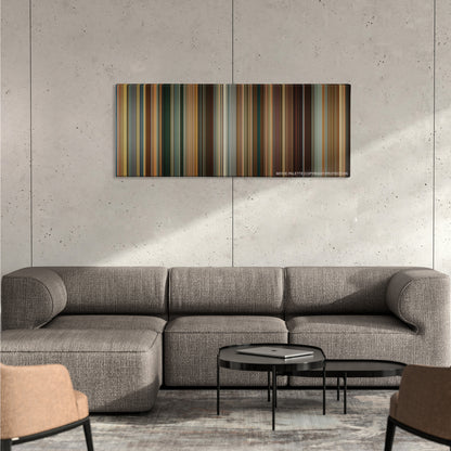 The Dictator color palette canvas on a concrete wall above a gray sectional sofa
