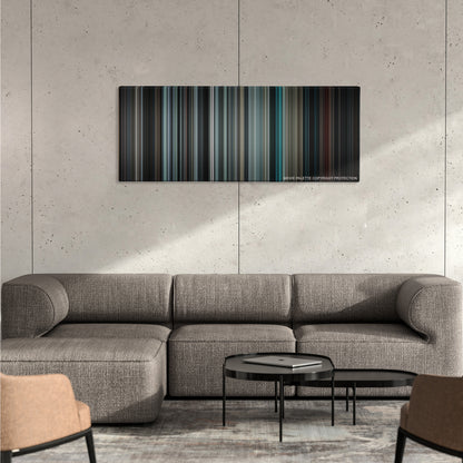 Insidious color palette canvas on a concrete wall above a gray sectional sofa