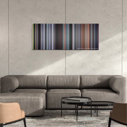 August Rush color palette canvas on a concrete wall above a gray sectional sofa
