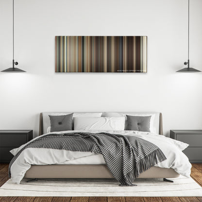 Frost/Nixon color palette canvas above a bed, between two black pendant lamps
