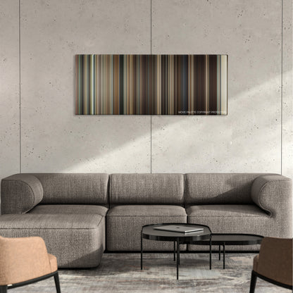Frost/Nixon color palette canvas on a concrete wall above a gray sectional sofa