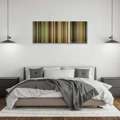 The Fall color palette canvas above a bed, between two black pendant lamps