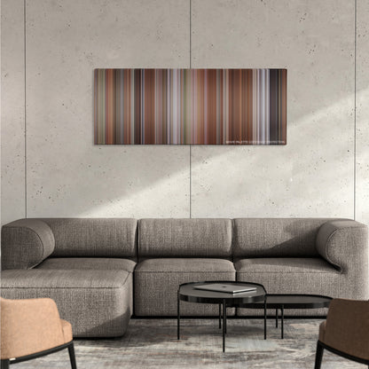 Liar Liar color palette canvas on a concrete wall above a gray sectional sofa