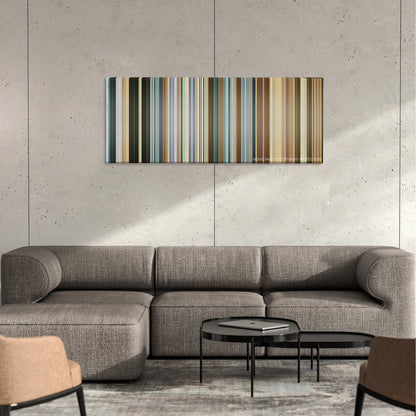 The Mexican color palette canvas on a concrete wall above a gray sectional sofa