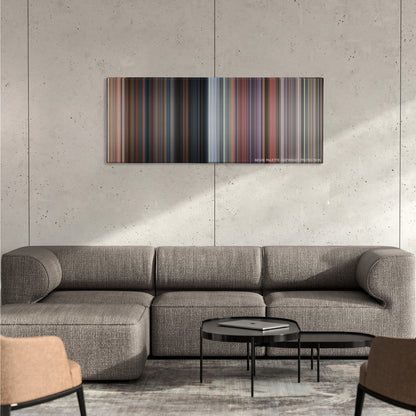 Death Proof color palette canvas on a concrete wall above a gray sectional sofa