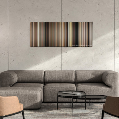 Bonnie and Clyde color palette canvas on a concrete wall above a gray sectional sofa