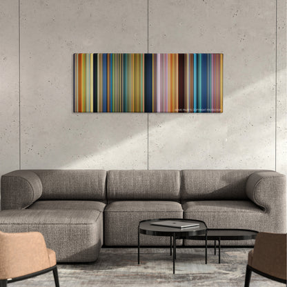 The Good Dinosaur color palette canvas on a concrete wall above a gray sectional sofa
