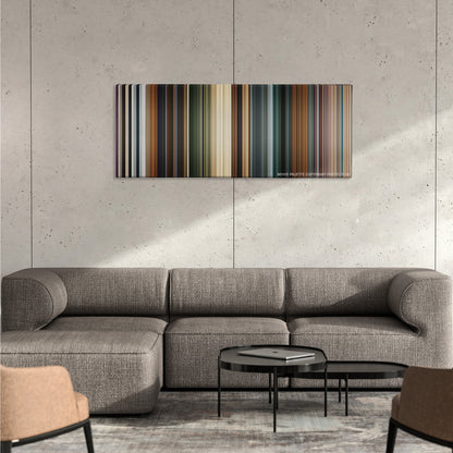 Clash of the Titans color palette canvas on a concrete wall above a gray sectional sofa