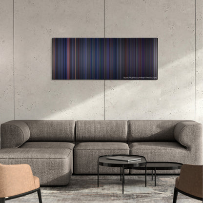 Crimson Tide color palette canvas on a concrete wall above a gray sectional sofa