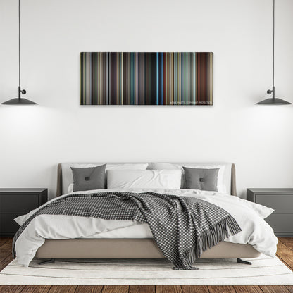 Stoker color palette canvas above a bed, between two black pendant lamps