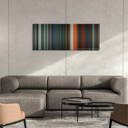 Saw VI color palette canvas on a concrete wall above a gray sectional sofa
