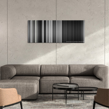 The Seventh Seal color palette canvas on a concrete wall above a gray sectional sofa