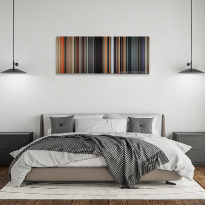 Divergent color palette canvas above a bed, between two black pendant lamps