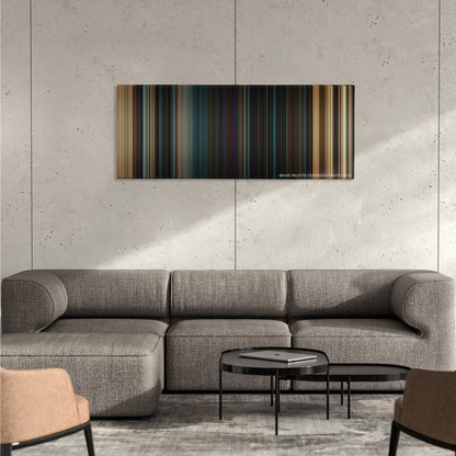 Fast & Furious color palette canvas on a concrete wall above a gray sectional sofa