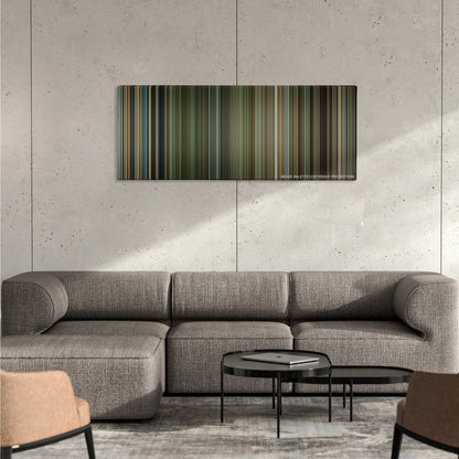 Lone Survivor color palette canvas on a concrete wall above a gray sectional sofa