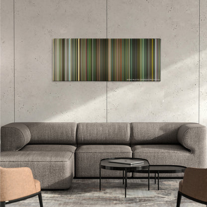 Dredd color palette canvas on a concrete wall above a gray sectional sofa