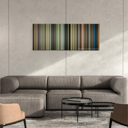 The Lucky One color palette canvas on a concrete wall above a gray sectional sofa