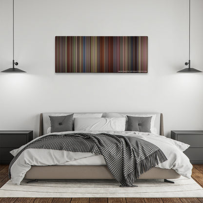 Sense and Sensibility color palette canvas above a bed, between two black pendant lamps