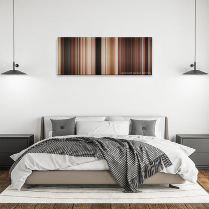 Maverick color palette canvas above a bed, between two black pendant lamps