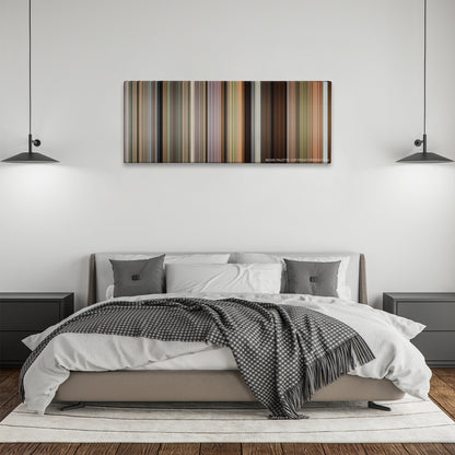 The Descendants color palette canvas above a bed, between two black pendant lamps