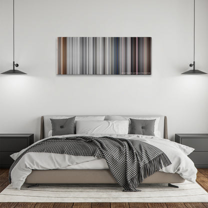 Pleasantville color palette canvas above a bed, between two black pendant lamps