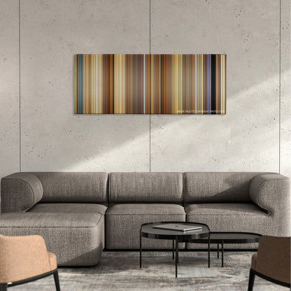 Meet the Spartans color palette canvas on a concrete wall above a gray sectional sofa