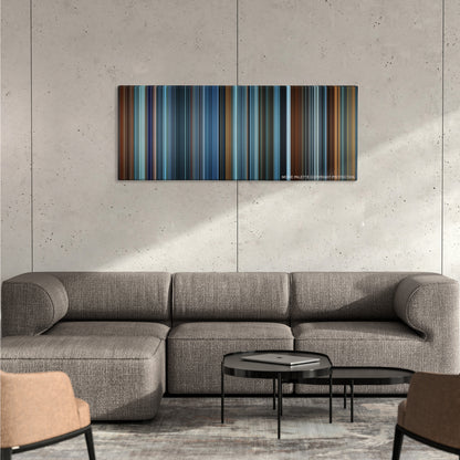 Red Dragon color palette canvas on a concrete wall above a gray sectional sofa