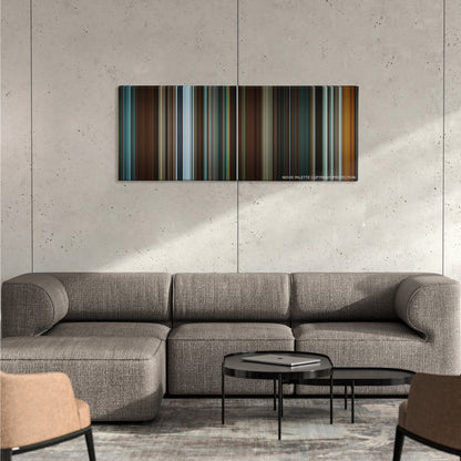 Predestination color palette canvas on a concrete wall above a gray sectional sofa