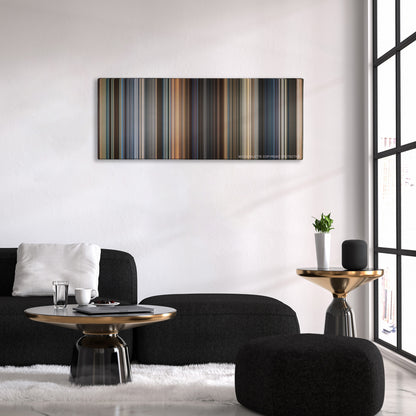 Now You See Me color palette canvas above a black sofa with a gold-topped table