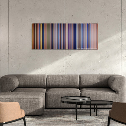 The Patriot color palette canvas on a concrete wall above a gray sectional sofa