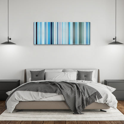 Happy Feet color palette canvas above a bed, between two black pendant lamps